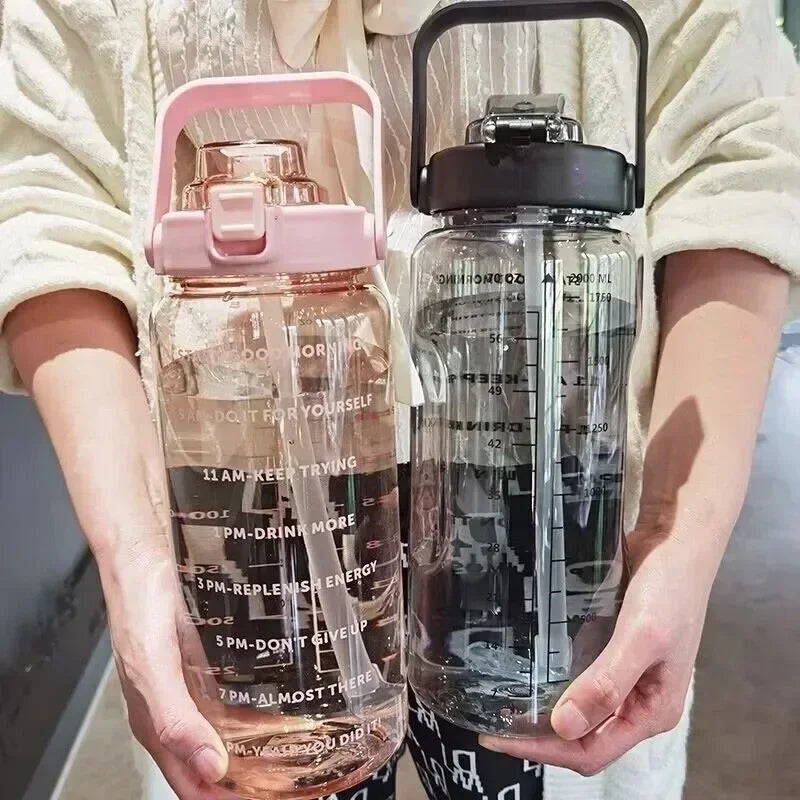 Valour Fit 2L motivational sports water bottle with time marker, clear plastic with measurement markings and secure lid.