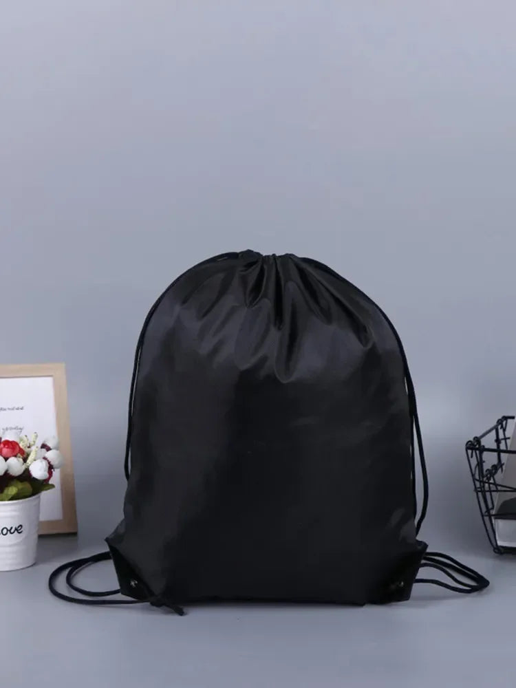 Valour Fit gym storage backpack with multiple pockets, black fabric, and adjustable straps, designed for organized gym gear.