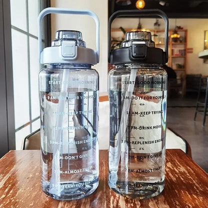 Valour Fit 2L straw water bottle with time marker, clear plastic design for tracking daily hydration.