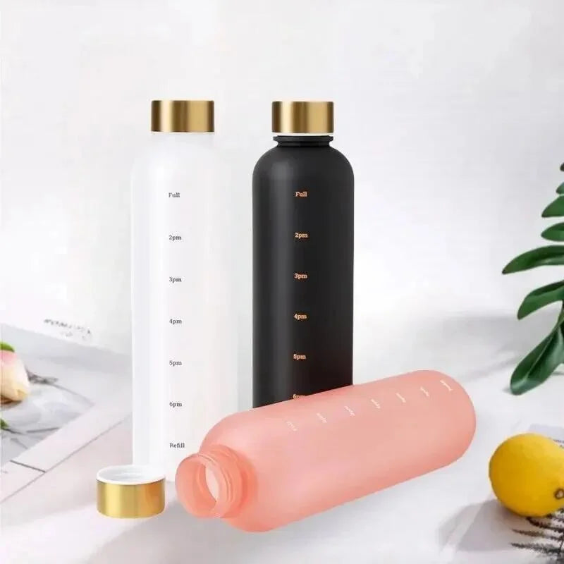 Valour Fit 1L motivational water bottle with time marker, clear plastic design and ergonomic lid for easy hydration.