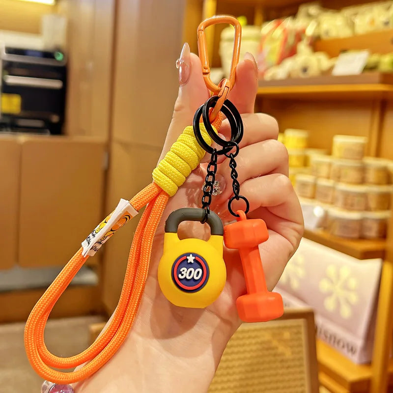 Valour Fit fitness keychain with D-shaped clip attached to a gym bag, durable fitness accessories for secure key or accessory holding.
