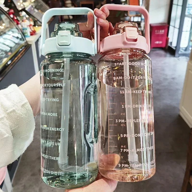 Valour Fit 2L motivational sports water bottle with time marker, clear plastic design and ergonomic lid for hydration.