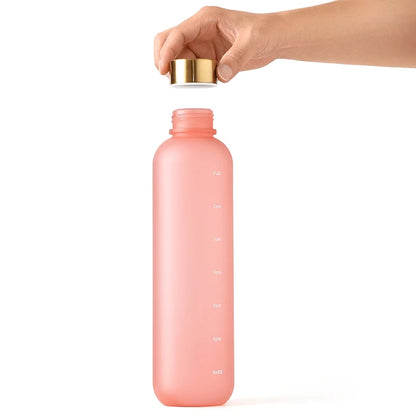 Valour Fit 1L motivational water bottle with time marker, clear plastic container with measurement lines and ergonomic lid.