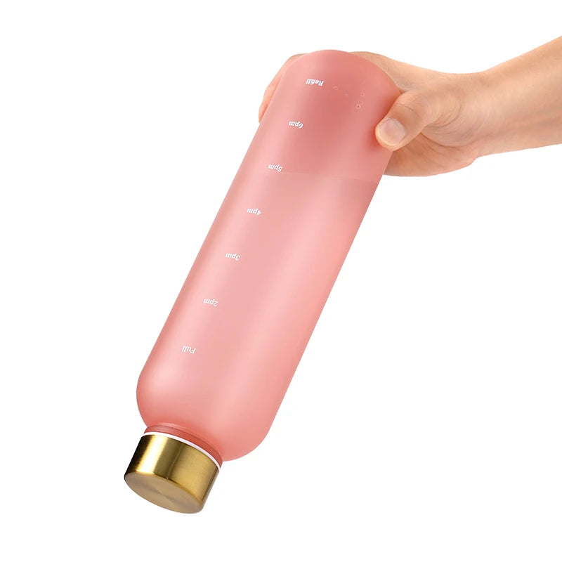 Valour Fit 1L motivational water bottle with time marker, clear plastic, ergonomic design, and leak-proof lid.