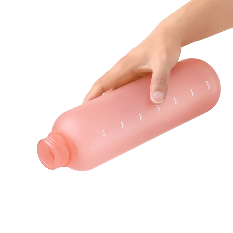 Valour Fit 1L motivational water bottle with time marker, clear plastic design, lid, and measurement markings for hydration tracking
