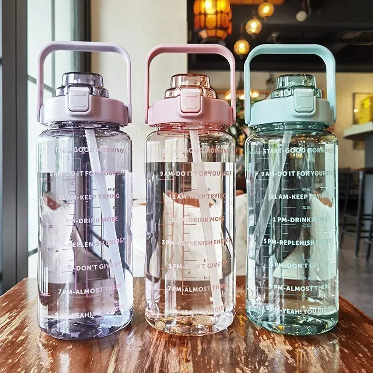 Valour Fit 2L straw water bottle with time marker, reusable plastic water bottle for hydration and fitness use.