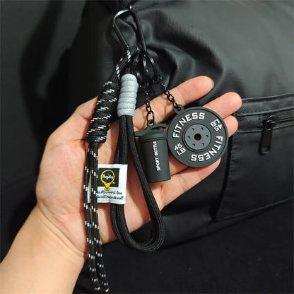 Valour Fit fitness keychain with D-shaped clip attached to a gym bag for easy carrying and quick access to workout accessories.