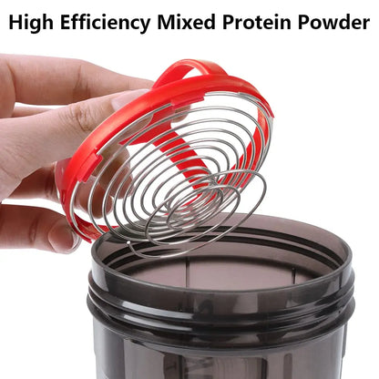 Valour Fit 3-layer protein shaker bottle with storage compartments, black with a flip-top lid and measurement markings.