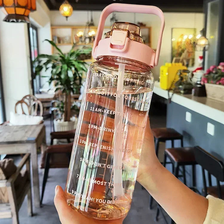 Valour Fit 2L motivational sports water bottle with time marker and leak-proof lid, ideal for fitness and hydration.