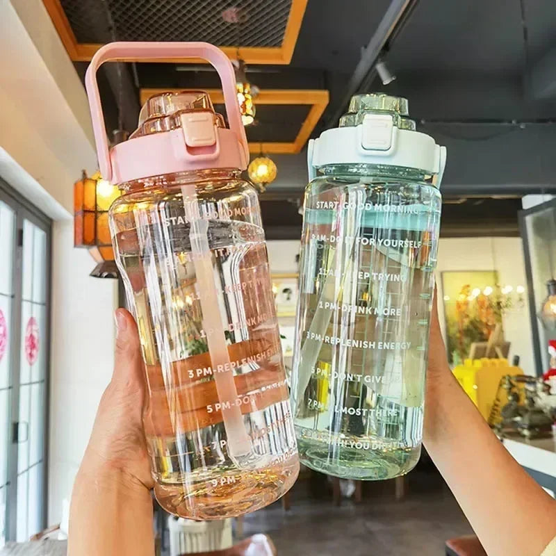 Valour Fit 2L sports water bottle with time marker, durable plastic, and ergonomic design for hydration during workouts.