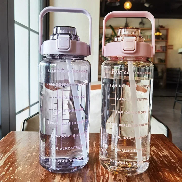 Valour Fit 2L straw water bottle with time marker, clear plastic design for tracking daily hydration.