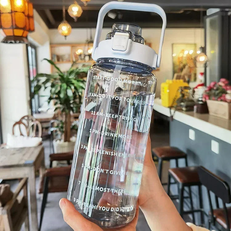 Valour Fit 2L straw water bottle with time marker showing clear measurement markings and a built-in straw for easy drinking.